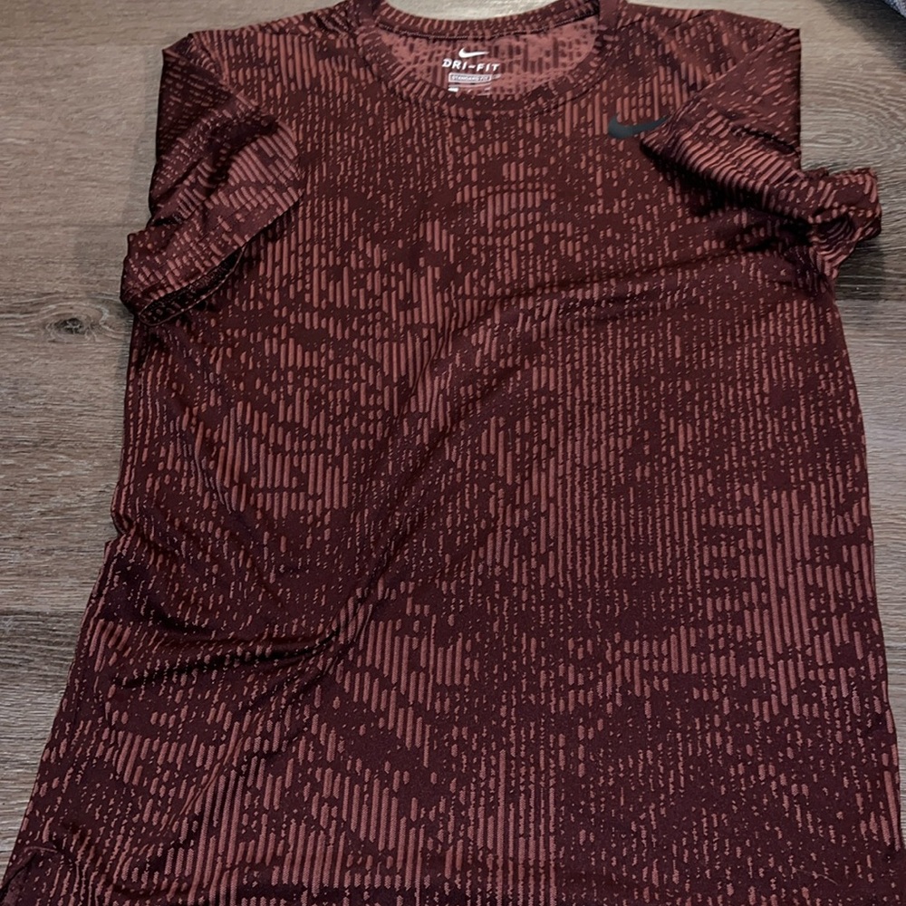 Nike dri fit standard fit small short sleeve tshirt. Burgundy/ maroon graphic.